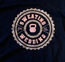 Load image into Gallery viewer, Wheel-type ring with inner ring and then "sweating for the wedding" in the inner part with a kettlebell in the center. In glitter pink and metallic pink vinyl