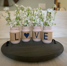 Load image into Gallery viewer, Four pink mason jars with the letters &quot;L O V E&quot; spelled out, one letter per jar
