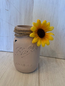mason jar with twine and sunflower