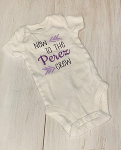 baby onesie that say new to the "customized with last name" crew