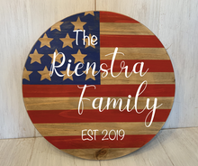 Load image into Gallery viewer, American Flag on wooden round with Family name personalization and established year
