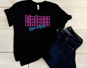 neon pink and blue vinyl with words saying spread kindness